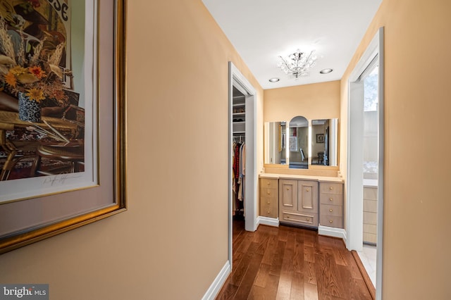 corridor with dark hardwood / wood-style floors