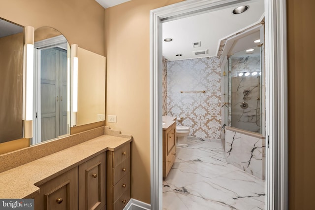 bathroom featuring vanity, toilet, and a shower with shower door