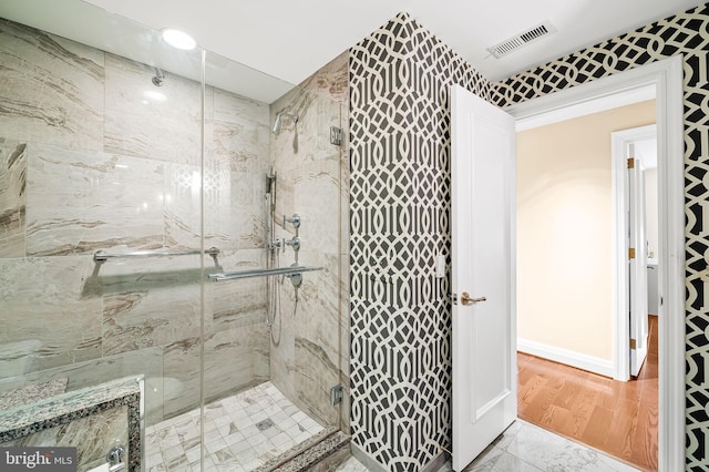 bathroom with an enclosed shower