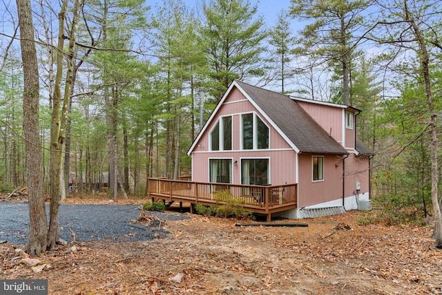 back of property featuring a deck