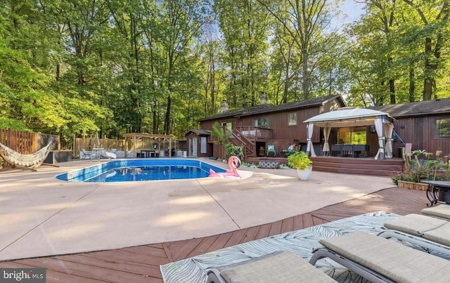 view of pool featuring a wooden deck