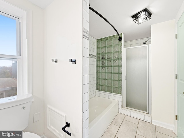 bathroom with tile patterned floors, independent shower and bath, and toilet