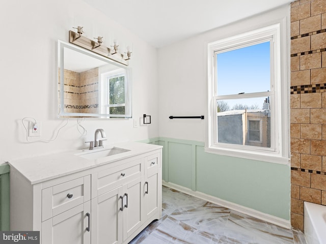 bathroom with vanity and a healthy amount of sunlight