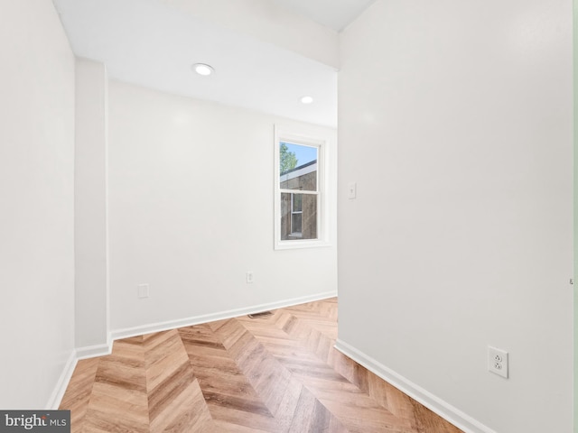 spare room featuring light parquet flooring