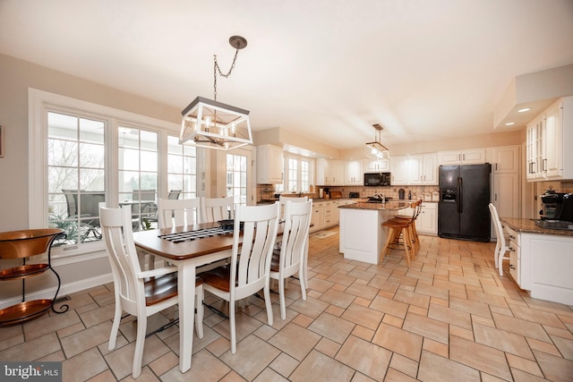 dining area with an inviting chandelier