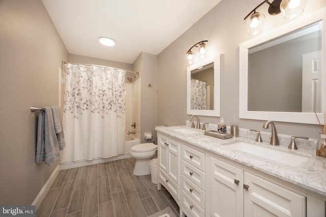 full bathroom featuring toilet, vanity, and shower / tub combo with curtain