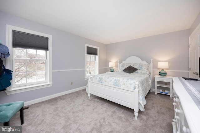 bedroom featuring light carpet