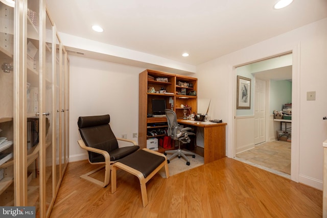 office with light hardwood / wood-style flooring