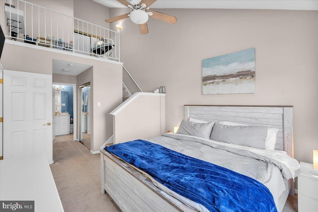 carpeted bedroom featuring connected bathroom and ceiling fan