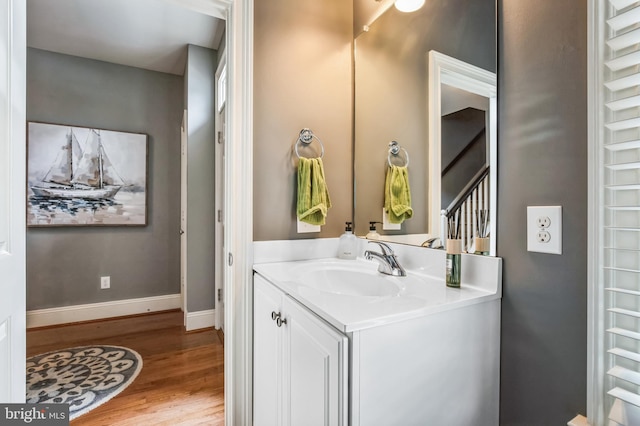 bathroom with hardwood / wood-style flooring and vanity