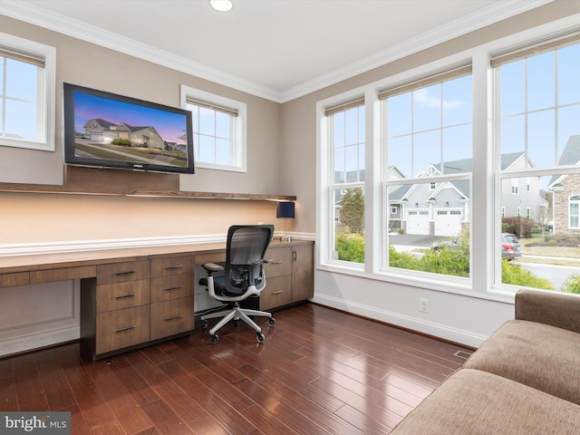 office area with crown molding, baseboards, built in desk, and dark wood-type flooring