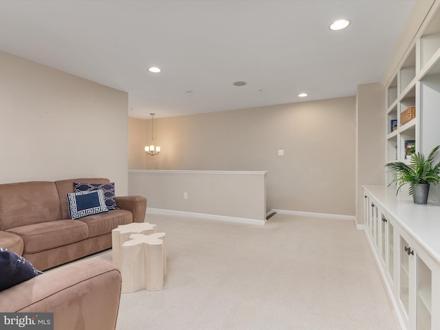 living area with a notable chandelier, recessed lighting, baseboards, and light carpet