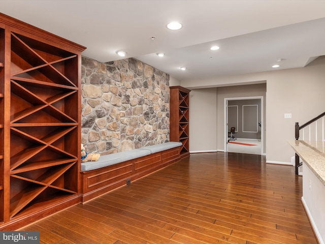 wine cellar featuring recessed lighting, baseboards, and wood finished floors