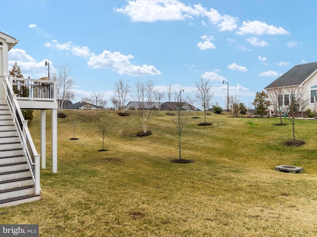 view of yard featuring stairway