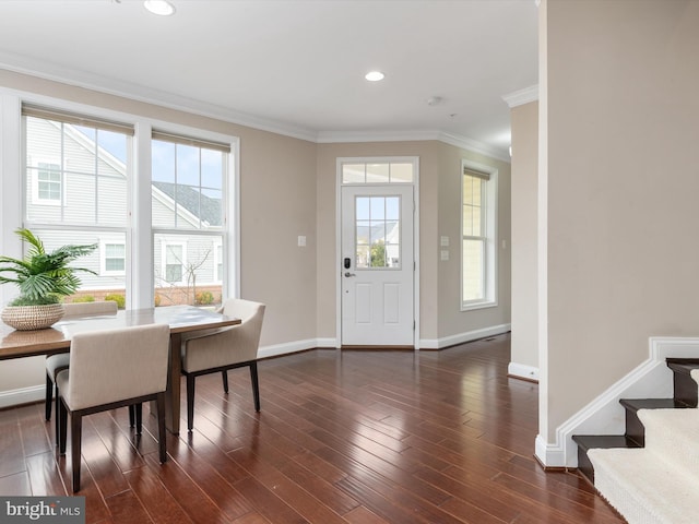 entrance foyer featuring ornamental molding, dark wood finished floors, recessed lighting, stairway, and baseboards