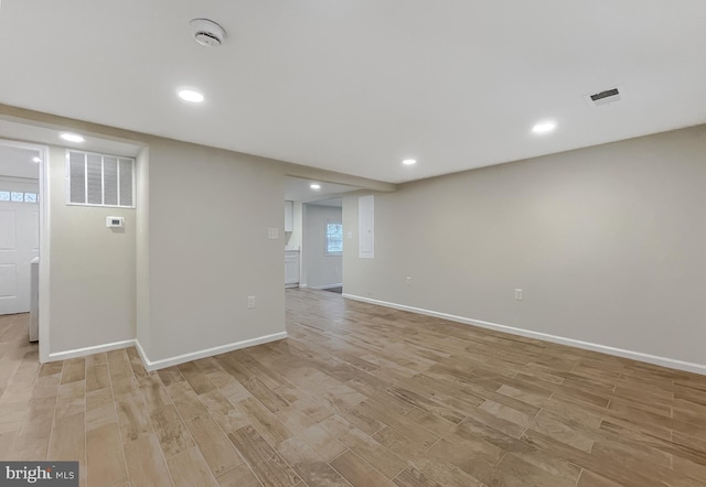 spare room with light wood-type flooring