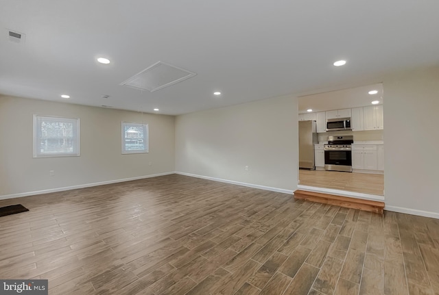 unfurnished living room featuring light wood-type flooring