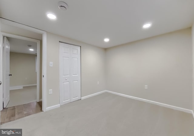 unfurnished bedroom with carpet and a closet