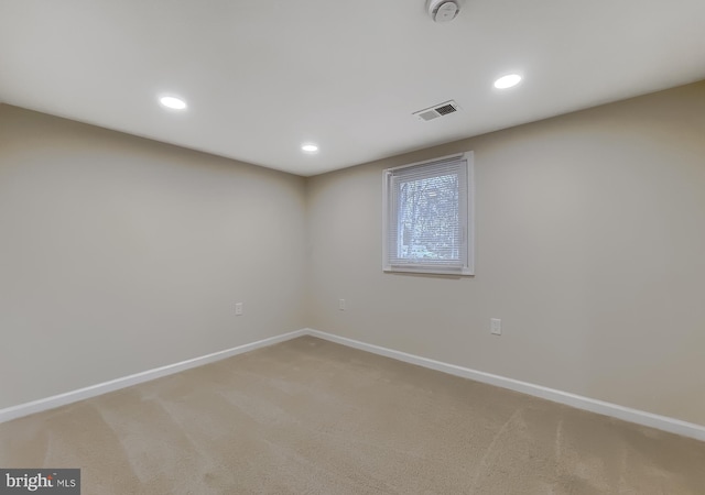 unfurnished room featuring carpet