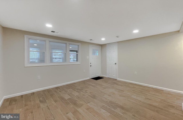 spare room featuring light hardwood / wood-style flooring