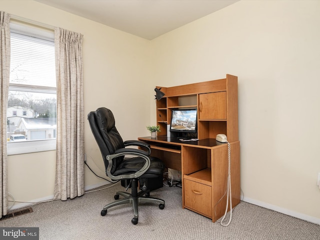 office area featuring light colored carpet