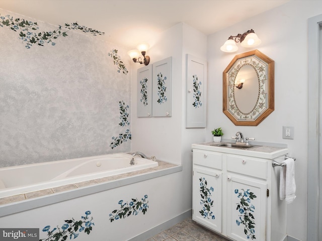 bathroom with tile patterned floors, a bath, and vanity