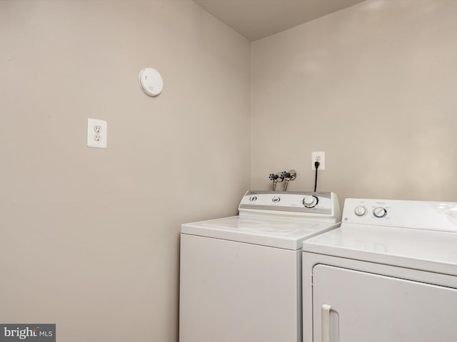 washroom featuring washing machine and dryer