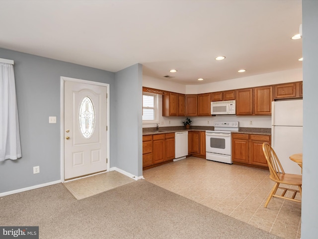 kitchen with sink and white appliances