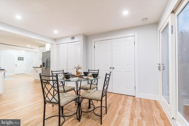 dining space featuring light hardwood / wood-style floors