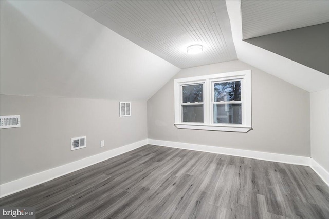 bonus room featuring hardwood / wood-style flooring and vaulted ceiling