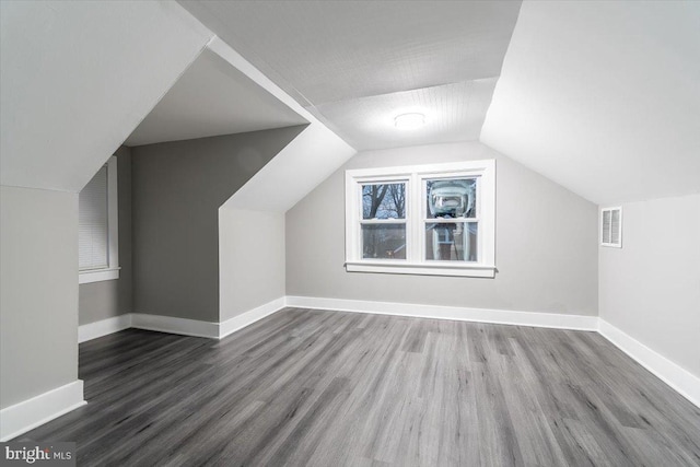 bonus room featuring hardwood / wood-style floors and lofted ceiling