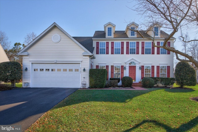 view of front facade featuring a garage and a front yard