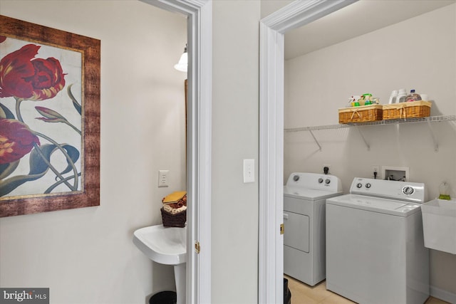 clothes washing area featuring washing machine and dryer