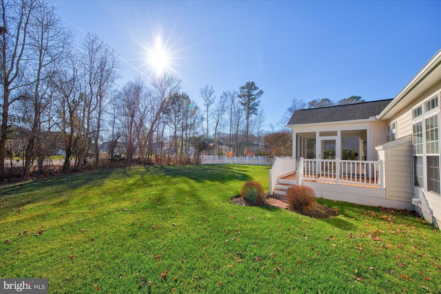 view of yard featuring a sunroom