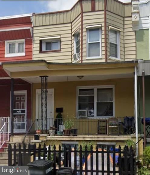 back of house with a porch