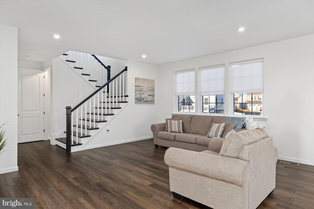 living room featuring dark hardwood / wood-style flooring