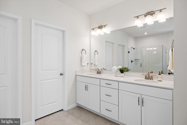 bathroom featuring vanity, tile patterned floors, and a shower with shower door