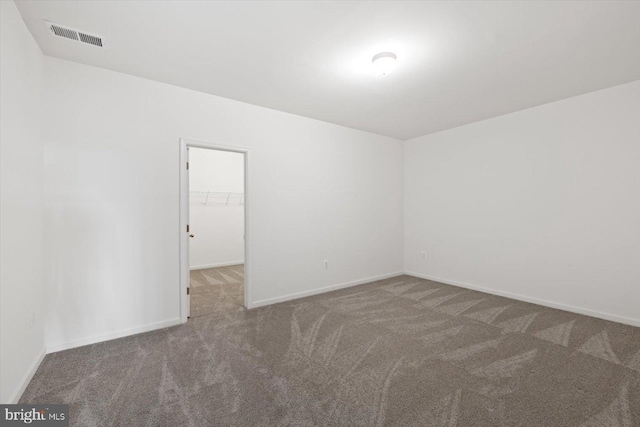 unfurnished room with carpet floors