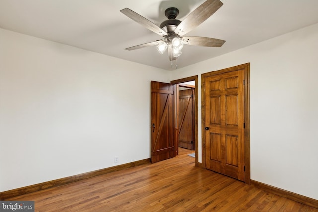 unfurnished bedroom with hardwood / wood-style flooring and ceiling fan