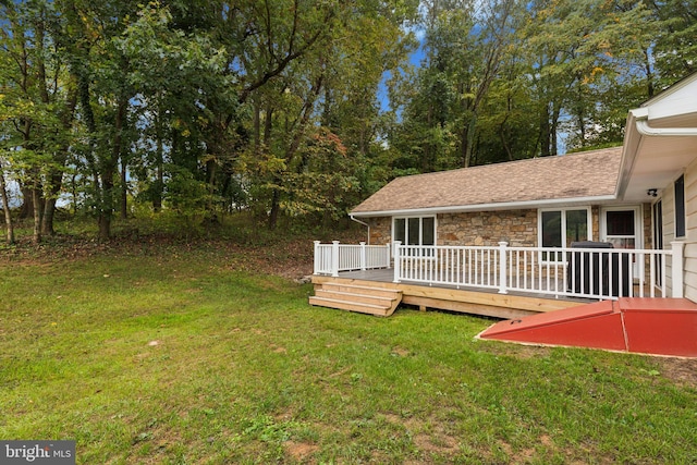 view of yard featuring a wooden deck