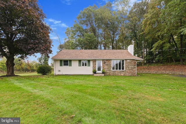 view of front of house with a front lawn