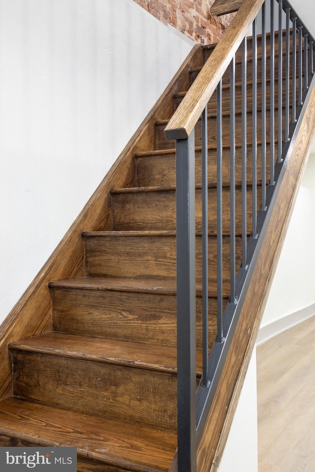 stairway with wood-type flooring