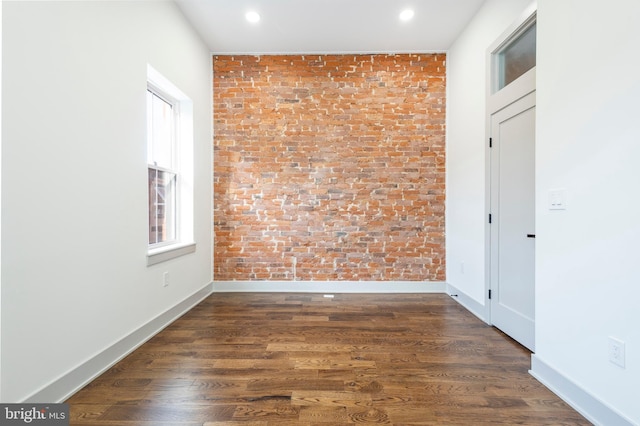 unfurnished room with dark hardwood / wood-style floors