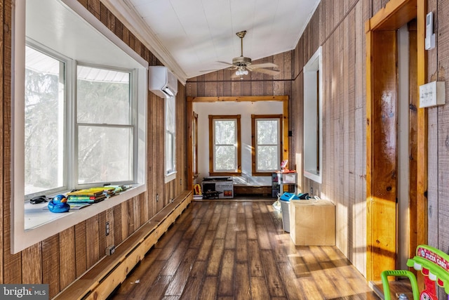 sunroom / solarium with a wall mounted air conditioner, ceiling fan, baseboard heating, and vaulted ceiling