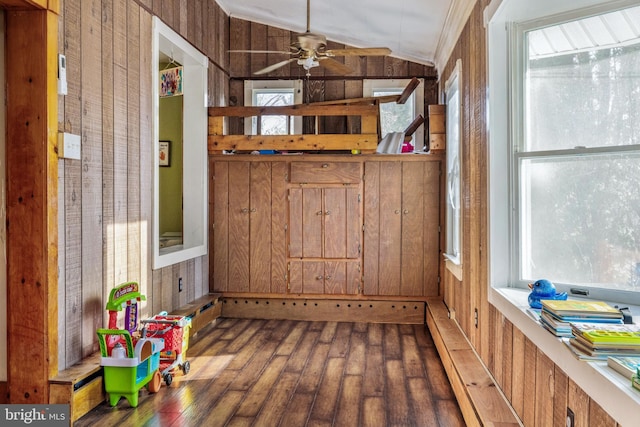 interior space with ceiling fan and lofted ceiling