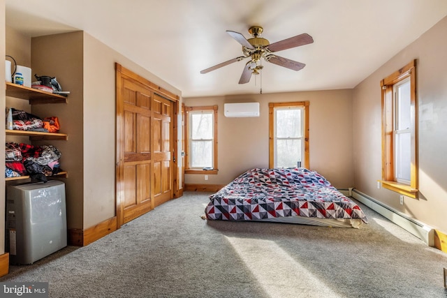 bedroom featuring carpet, ceiling fan, baseboard heating, and a wall unit AC