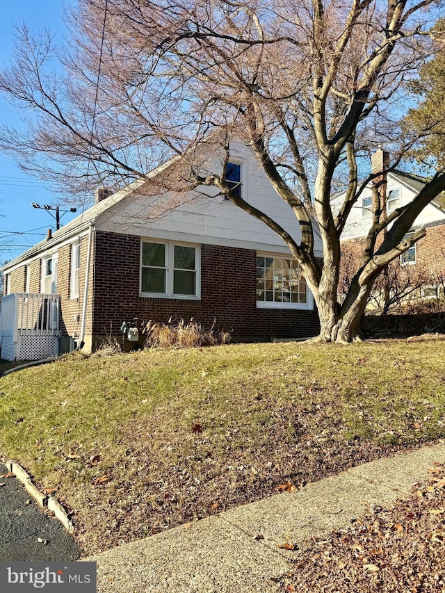 view of property exterior featuring a yard