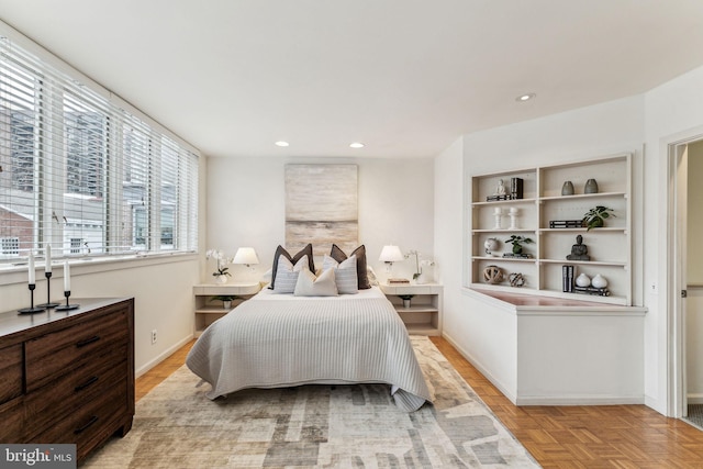 bedroom featuring light parquet flooring