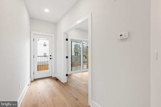 entryway with light hardwood / wood-style flooring