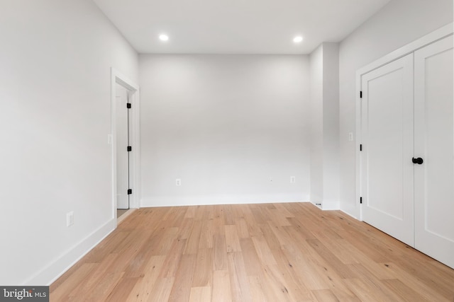 empty room with light hardwood / wood-style floors